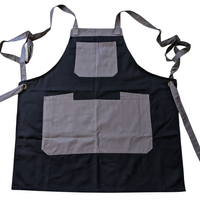 Black apron with grey straps and pockets